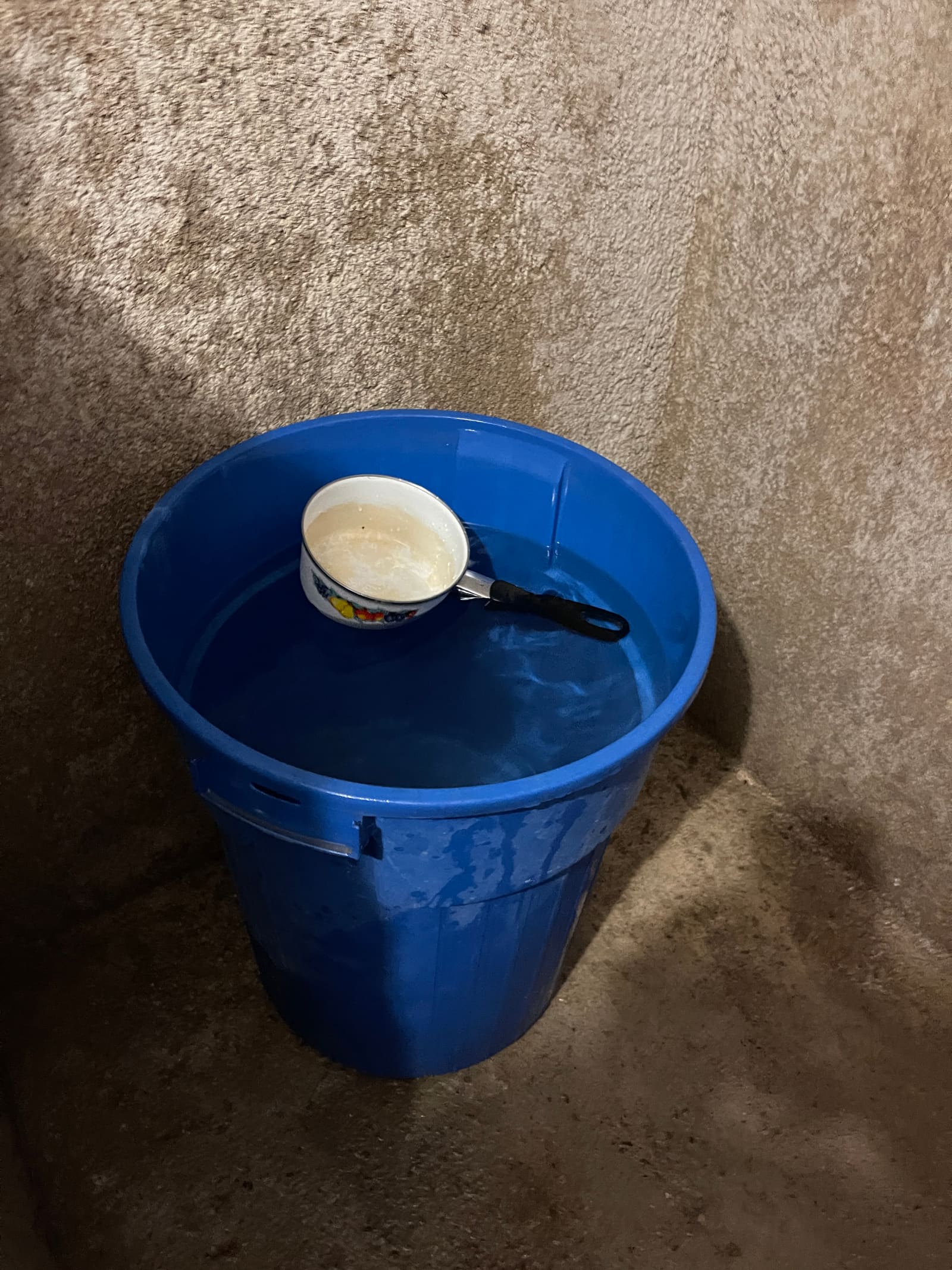 The 32-gallon trash can that served as a shower